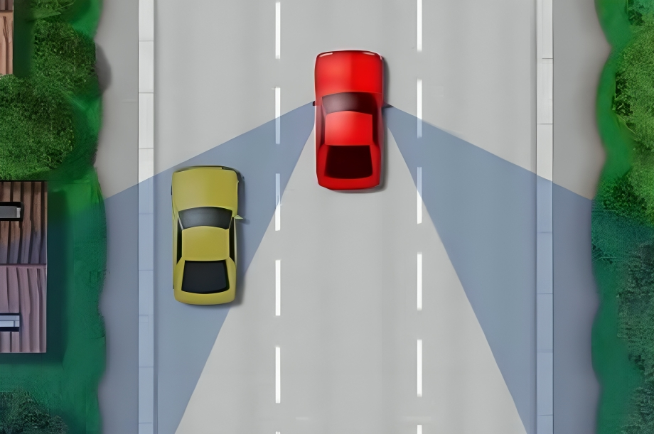 A red car and yellow car driving on the road.